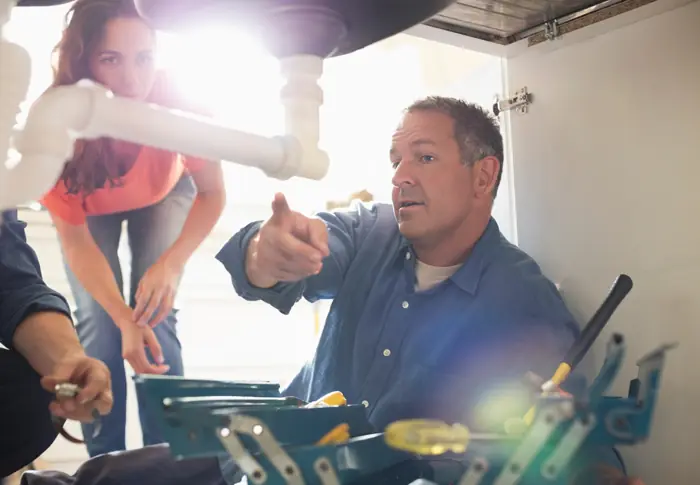 Drain Tech Plumbing technician consulting with a Glendale customer